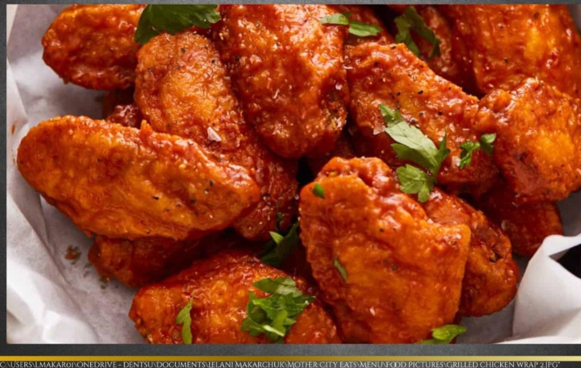 Crispy tossed wings in a sharing bowl